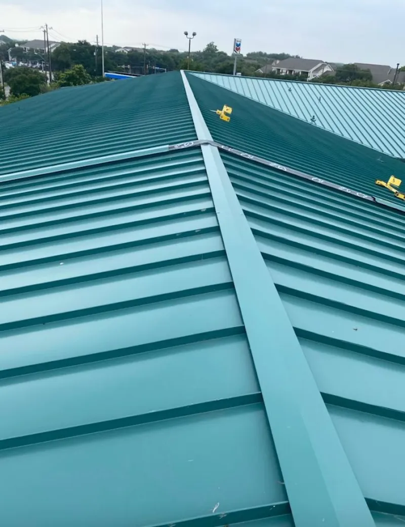 Green commercial metal roof ridge and valley for Metal Roof Repair in Claremont